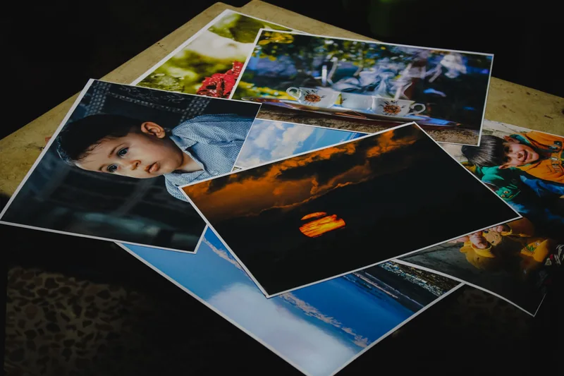 A collection of real printed photographs — illustrative stock reference